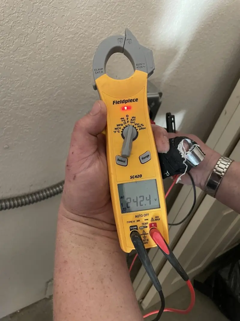 Voltage testing with clamp meter during Ceiling Fan Installation in Glens Falls